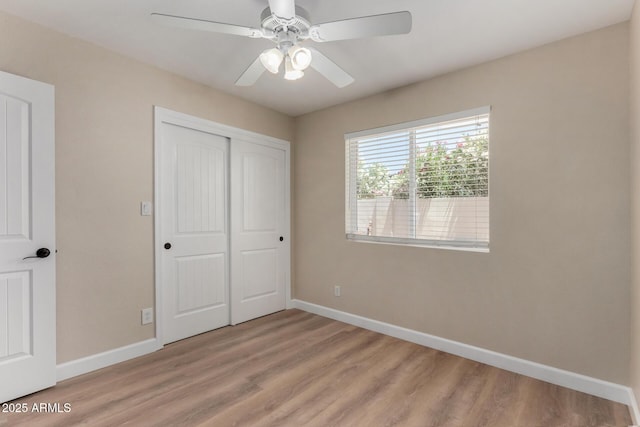 1535 E Kenwood St, Mesa, AZ 85203 - unfurnished bedroom featuring baseboards, light wood-style floors, a closet, and ceiling fan