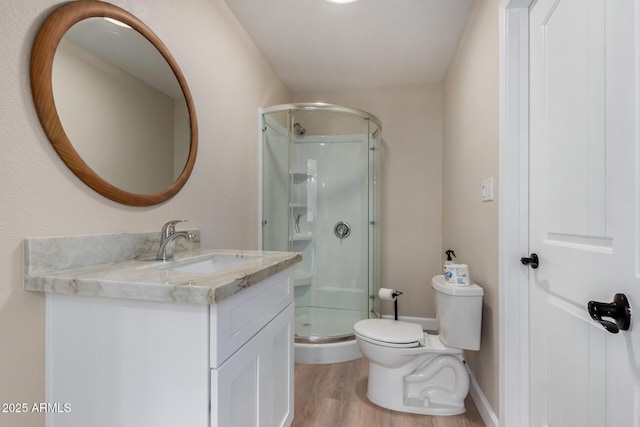 1535 E Kenwood St, Mesa, AZ 85203 - full bath featuring a shower stall, vanity, wood finished floors, and toilet