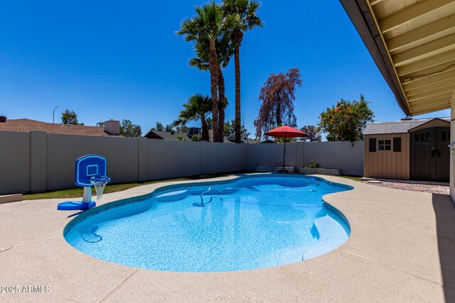 1535 E Kenwood St, Mesa, AZ 85203 - view of swimming pool featuring a fenced backyard, a storage shed, an outdoor structure, and a patio