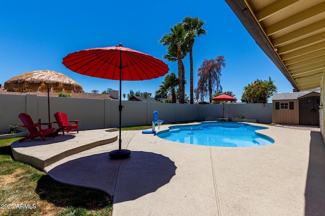 1535 E Kenwood St, Mesa, AZ 85203 - view of pool with a patio area, a fenced backyard, a storage shed, and an outbuilding