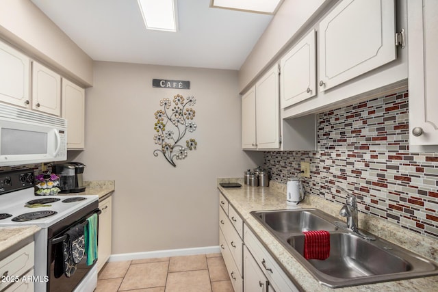 kitchen with white cabinetry, range with electric stovetop, a sink, and white microwave