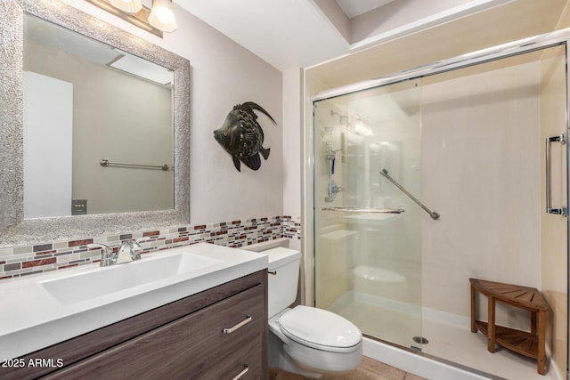 full bath with toilet, a stall shower, tasteful backsplash, and vanity