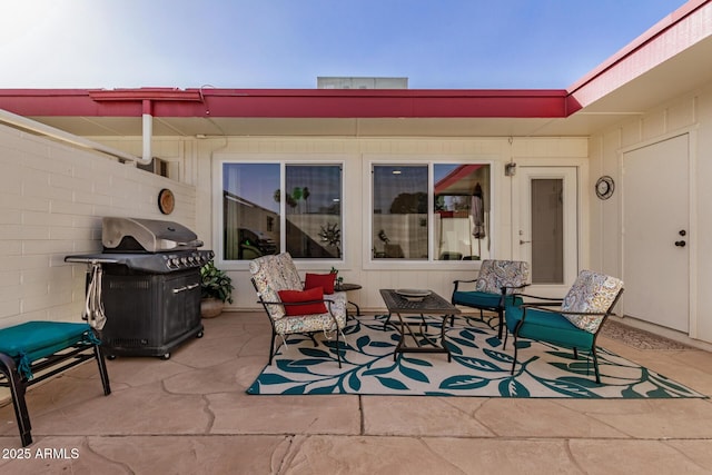 view of patio featuring fence and area for grilling