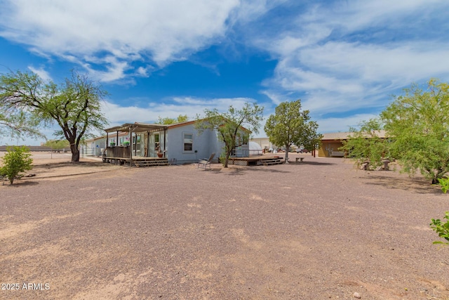 23948 W Jomax Rd, Wittmann, AZ 85361 - back of house with a deck