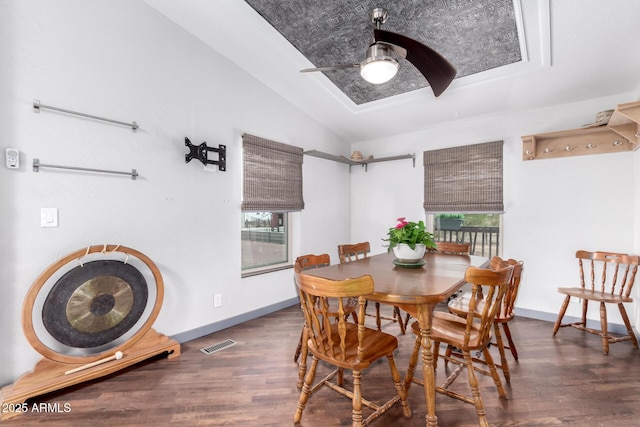 23948 W Jomax Rd, Wittmann, AZ 85361 - dining space with lofted ceiling, wood finished floors, ceiling fan, and baseboards