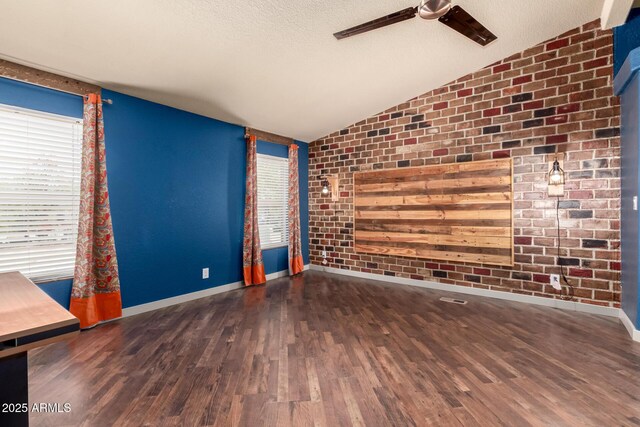 23948 W Jomax Rd, Wittmann, AZ 85361 - unfurnished living room featuring lofted ceiling, a ceiling fan, baseboards, wood finished floors, and healthy amount of natural light