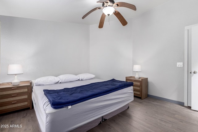 23948 W Jomax Rd, Wittmann, AZ 85361 - bedroom with wood finished floors and a ceiling fan