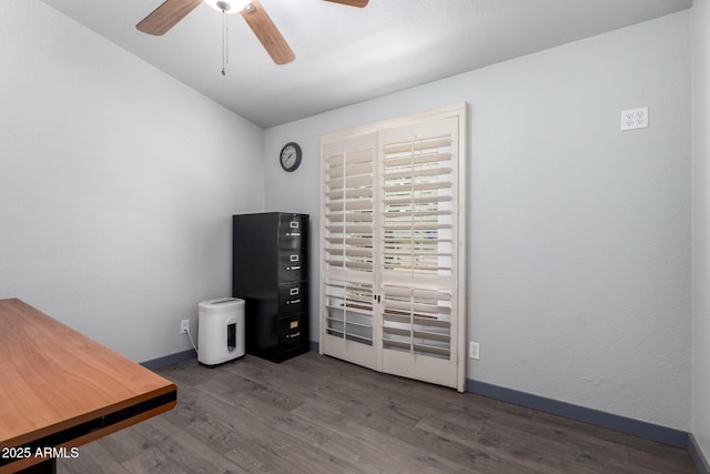 23948 W Jomax Rd, Wittmann, AZ 85361 - unfurnished office with a ceiling fan, wood finished floors, and baseboards
