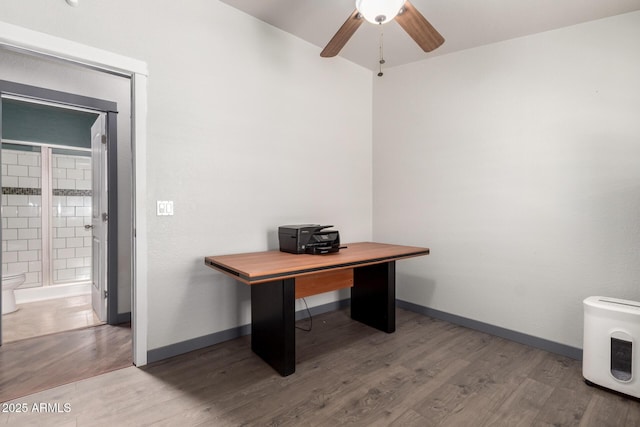 23948 W Jomax Rd, Wittmann, AZ 85361 - office space with wood finished floors, ceiling fan, and baseboards