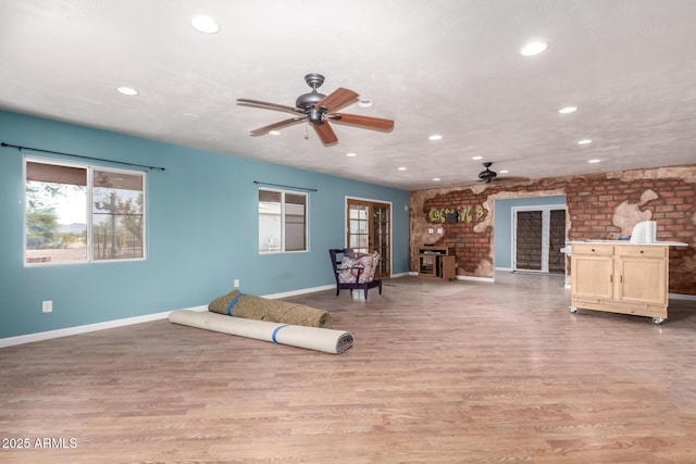 23948 W Jomax Rd, Wittmann, AZ 85361 - living area with a ceiling fan, baseboards, healthy amount of natural light, and recessed lighting
