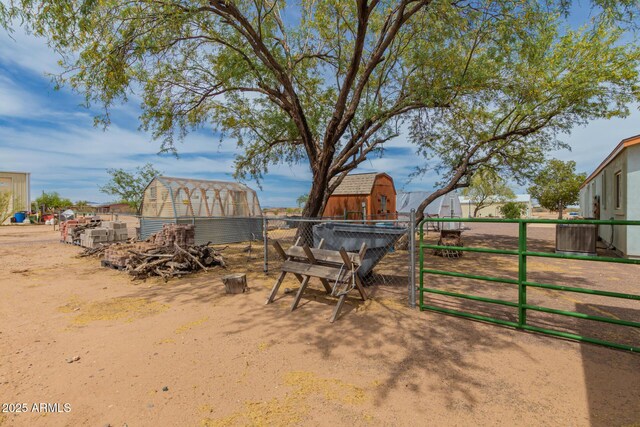 23948 W Jomax Rd, Wittmann, AZ 85361 - view of yard featuring central AC unit