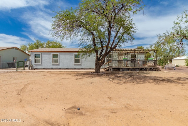 23948 W Jomax Rd, Wittmann, AZ 85361 - back of house with a deck, a pergola, and stucco siding