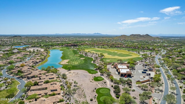 birds eye view of property with a water and mountain view