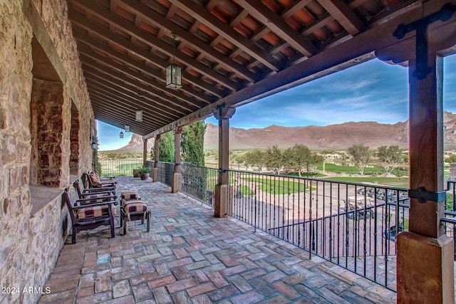 view of patio / terrace featuring a mountain view