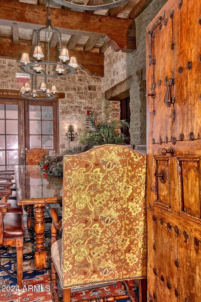 dining space featuring beam ceiling