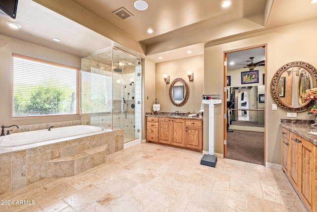 bathroom featuring vanity, ceiling fan, and independent shower and bath