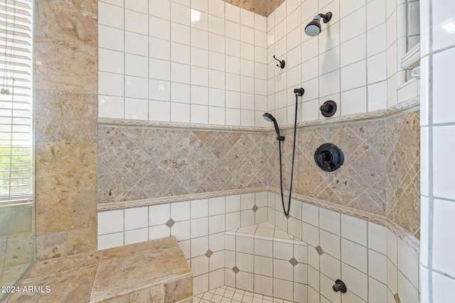 bathroom with tiled shower