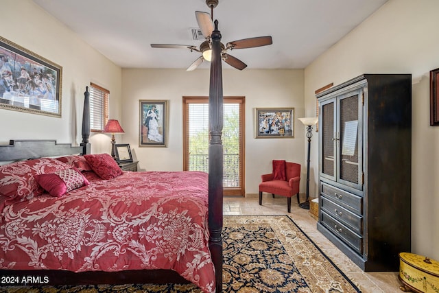 bedroom with ceiling fan and light tile patterned flooring