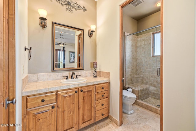 bathroom with vanity, toilet, and walk in shower