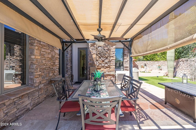 view of patio / terrace featuring ceiling fan