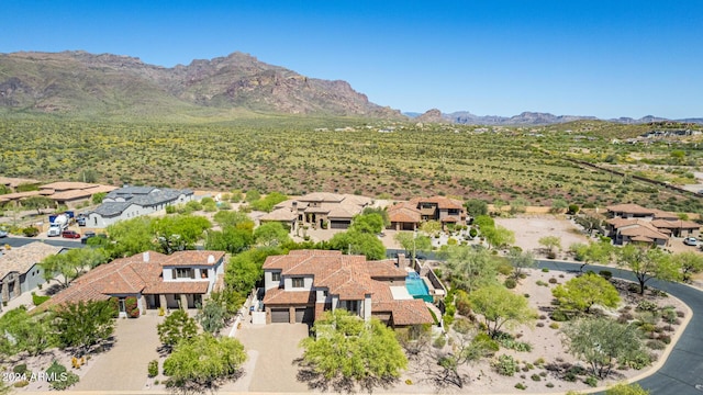 birds eye view of property featuring a mountain view