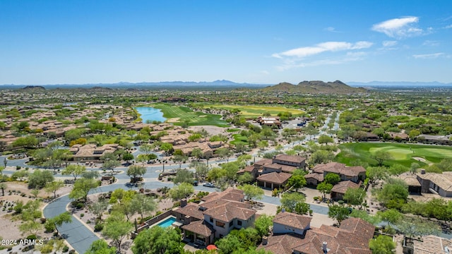 drone / aerial view featuring a water and mountain view