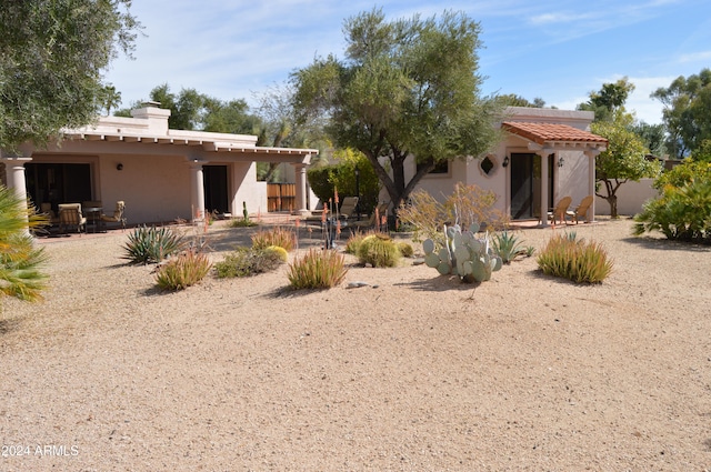 back of house with a patio