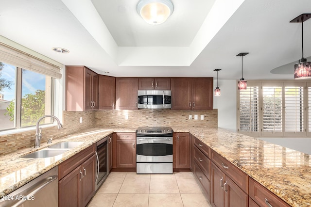 kitchen featuring sink, beverage cooler, stainless steel appliances, decorative light fixtures, and light tile patterned floors