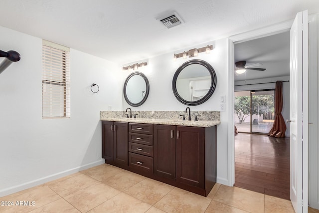 bathroom featuring hardwood / wood-style floors, ceiling fan, and vanity