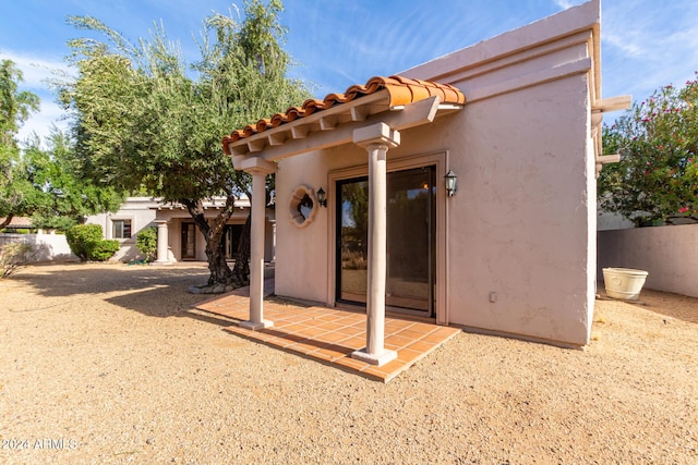 back of house with a patio area