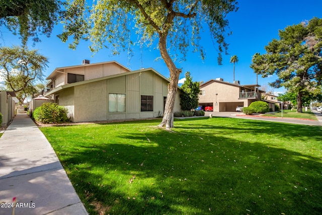 view of home's exterior featuring a lawn