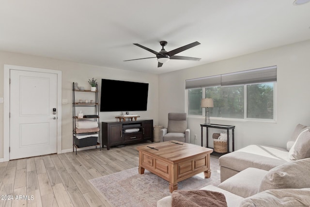 living room with ceiling fan and light hardwood / wood-style floors