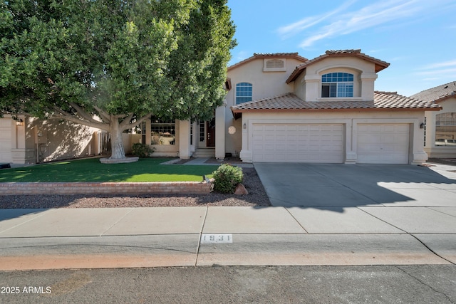 mediterranean / spanish house with a garage and a front lawn