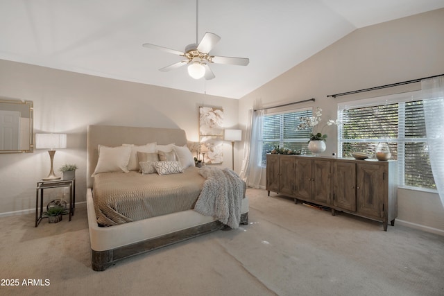 bedroom featuring multiple windows, vaulted ceiling, and carpet flooring