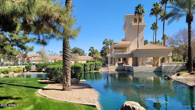 view of pool with a yard and fence