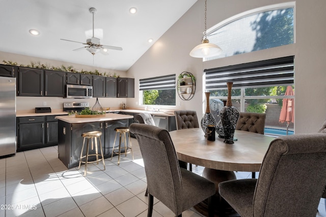 dining area with recessed lighting, high vaulted ceiling, ceiling fan, and light tile patterned flooring