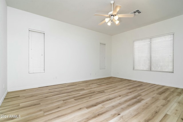 unfurnished room featuring ceiling fan and light hardwood / wood-style flooring