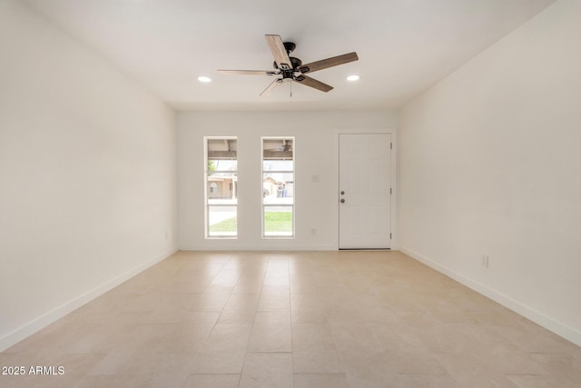empty room featuring recessed lighting, ceiling fan, and baseboards