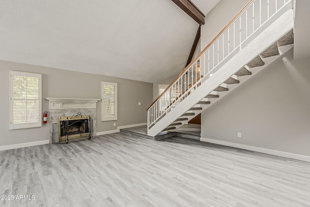 4627 E Mcneil St, Phoenix, AZ 85044 - unfurnished living room with wood finished floors, stairs, baseboards, and plenty of natural light