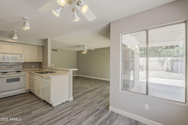 4627 E Mcneil St, Phoenix, AZ 85044 - kitchen featuring white appliances, a ceiling fan, a sink, a peninsula, and baseboards