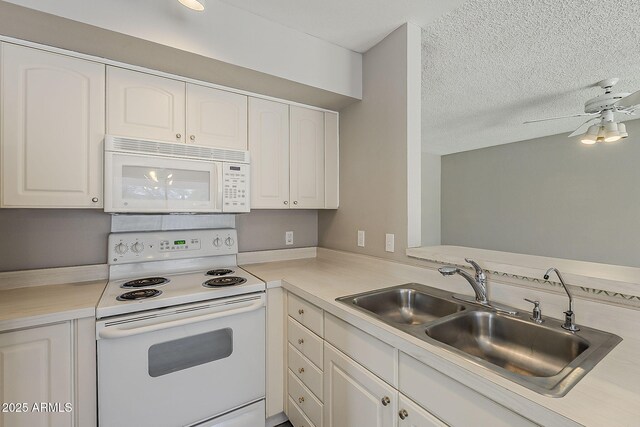 4627 E Mcneil St, Phoenix, AZ 85044 - kitchen featuring white appliances, a sink, white cabinets, a textured ceiling, and light countertops