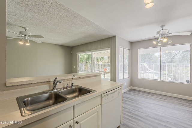 4627 E Mcneil St, Phoenix, AZ 85044 - kitchen featuring dishwasher, a sink, ceiling fan, light countertops, and white cabinetry