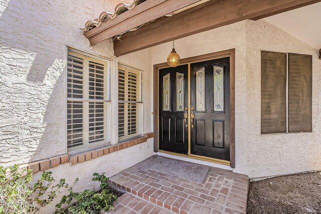 4627 E Mcneil St, Phoenix, AZ 85044 - doorway to property with stucco siding
