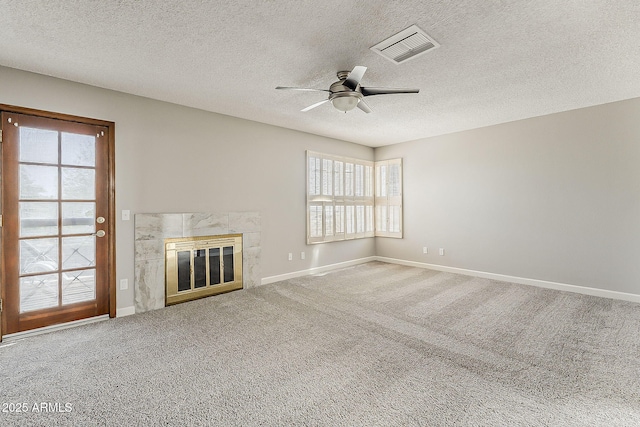 4627 E Mcneil St, Phoenix, AZ 85044 - unfurnished living room featuring healthy amount of natural light, a ceiling fan, carpet, baseboards, and a textured ceiling