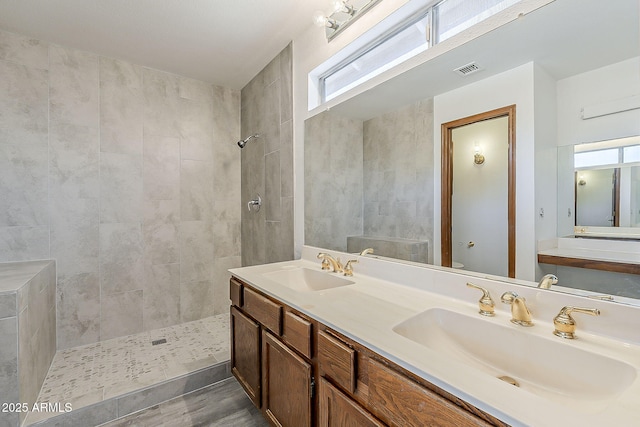 4627 E Mcneil St, Phoenix, AZ 85044 - full bath featuring a tile shower, double vanity, and wood finished floors