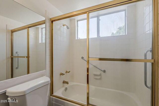 4627 E Mcneil St, Phoenix, AZ 85044 - bathroom featuring combined bath / shower with glass door and toilet