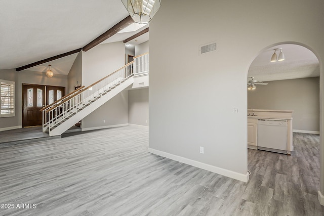 4627 E Mcneil St, Phoenix, AZ 85044 - unfurnished living room with stairs, baseboards, wood finished floors, arched walkways, and ceiling fan