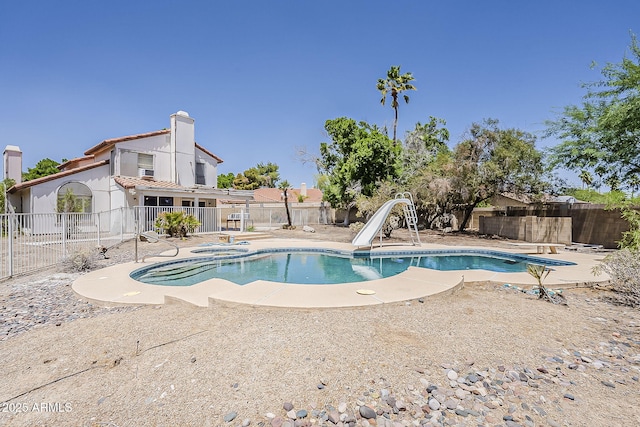 4627 E Mcneil St, Phoenix, AZ 85044 - view of swimming pool with a fenced backyard, a water slide, an in-ground hot tub, and a patio area