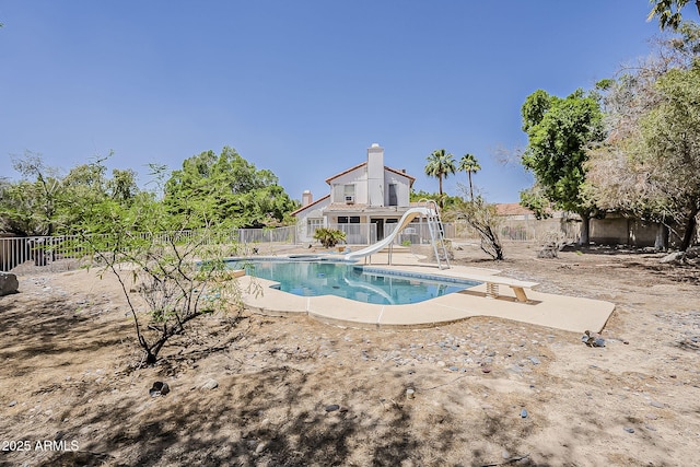 4627 E Mcneil St, Phoenix, AZ 85044 - view of pool with a water slide, fence, a patio area, and a diving board