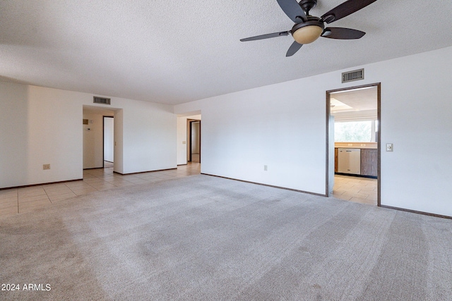 interior space with light carpet, a textured ceiling, and ceiling fan